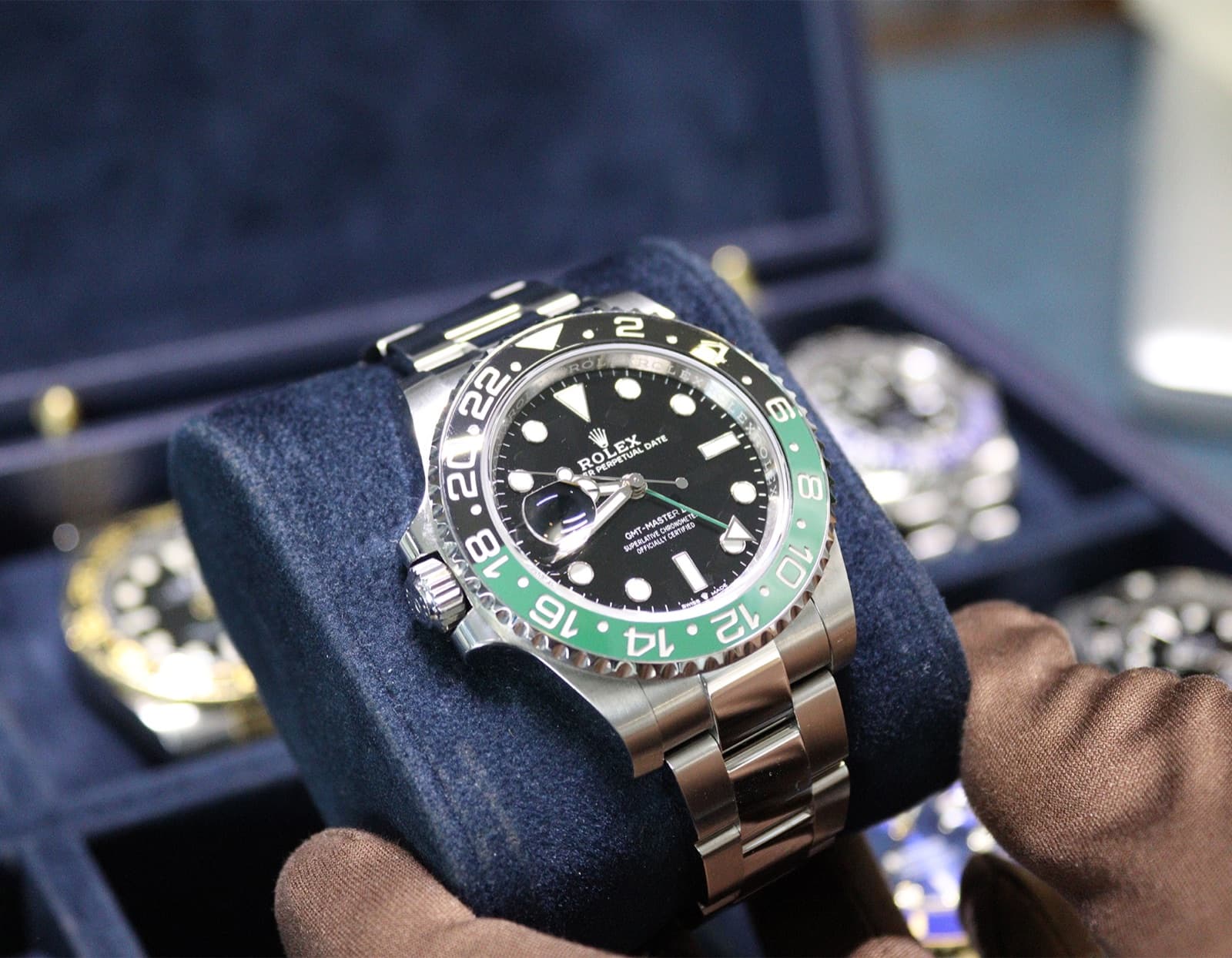 A Rolex watch being inspected at our boutique