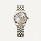 Luxury watch with silver and gold band on a white background